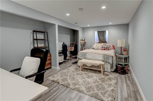 2013 NE Summerfield Ct, Blue Springs, MO 64029 - bedroom with wood finished floors, a closet, and recessed lighting