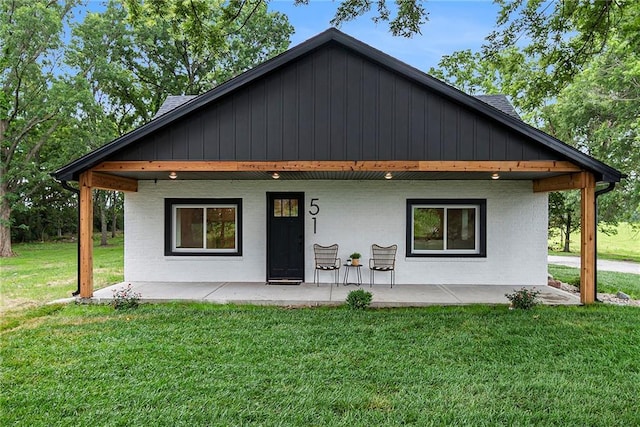 51 SE 208th St, Holt, MO 64048 - view of front of property featuring a front yard and a patio area