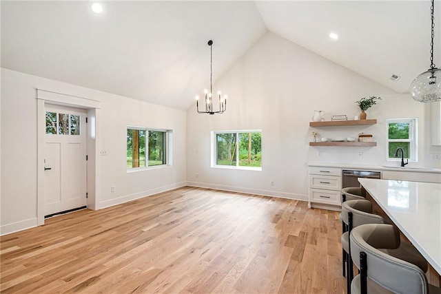 51 SE 208th St, Holt, MO 64048 - kitchen featuring a chandelier, white cabinets, light countertops, pendant lighting, and healthy amount of natural light