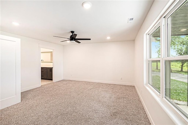 51 SE 208th St, Holt, MO 64048 - spare room featuring light colored carpet, healthy amount of natural light, ceiling fan, and recessed lighting