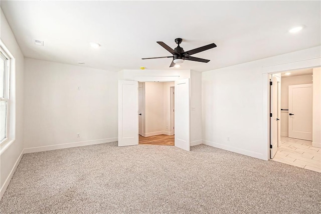 51 SE 208th St, Holt, MO 64048 - unfurnished bedroom featuring light colored carpet, recessed lighting, a ceiling fan, and connected bathroom