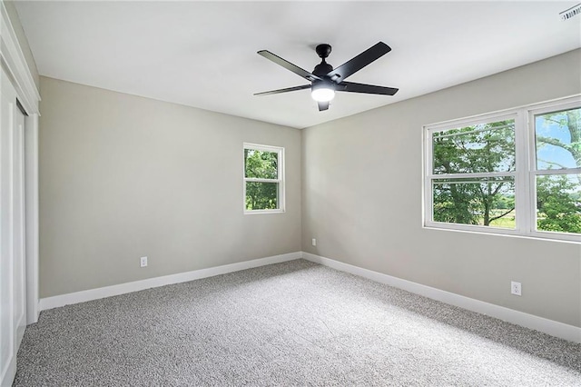 51 SE 208th St, Holt, MO 64048 - carpeted spare room with healthy amount of natural light and a ceiling fan