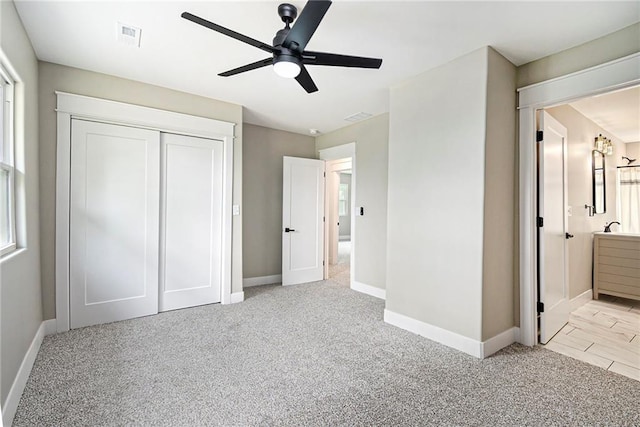51 SE 208th St, Holt, MO 64048 - unfurnished bedroom with carpet flooring, a closet, ensuite bath, and ceiling fan