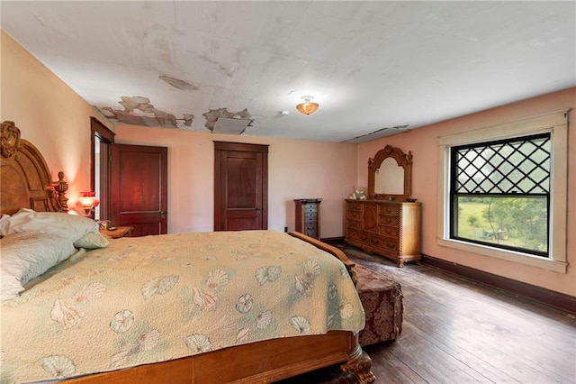 1080 SW 58th Hwy, Holden, MO 64040 - bedroom featuring wood-type flooring and baseboards
