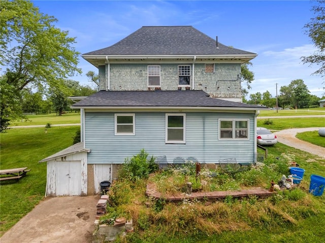 1080 SW 58th Hwy, Holden, MO 64040 - rear view of house with a yard, roof with shingles, and a storage shed