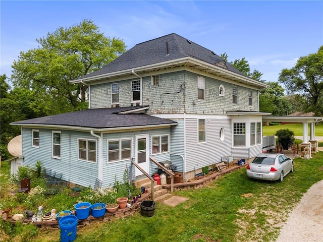 1080 SW 58th Hwy, Holden, MO 64040 - rear view of house featuring entry steps, a yard, and a shingled roof