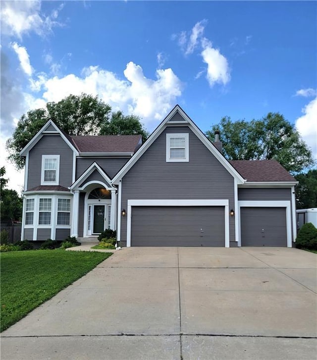 20586 W 220th St, Spring Hill, KS 66083 - view of front facade featuring driveway, a front yard, a garage, and roof with shingles