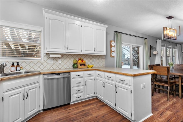 20586 W 220th St, Spring Hill, KS 66083 - kitchen featuring dishwasher, a peninsula, dark wood-style flooring, and tasteful backsplash