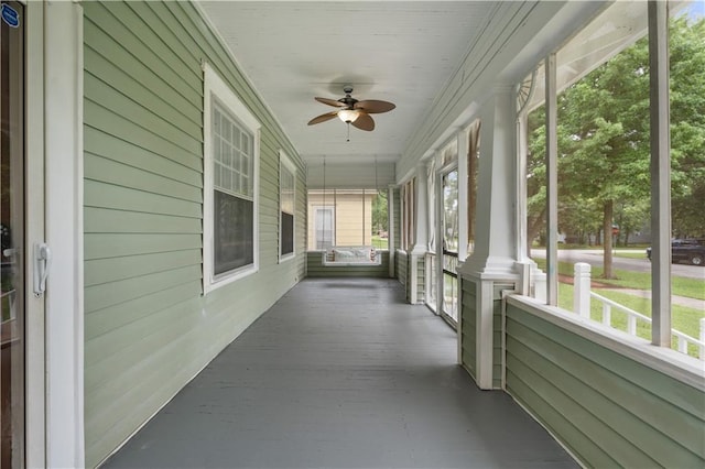 704 Lincoln St, Coffeyville, KS 67337 - unfurnished sunroom with ceiling fan and healthy amount of natural light