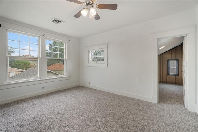 704 Lincoln St, Coffeyville, KS 67337 - unfurnished room featuring carpet floors and a ceiling fan