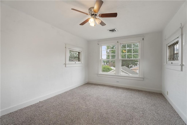 704 Lincoln St, Coffeyville, KS 67337 - spare room with light carpet and ceiling fan