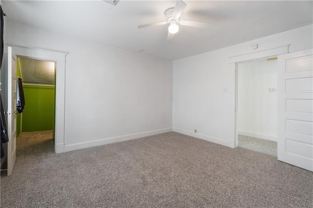 704 Lincoln St, Coffeyville, KS 67337 - carpeted empty room featuring ceiling fan and baseboards
