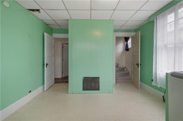 704 Lincoln St, Coffeyville, KS 67337 - unfurnished bedroom with a drop ceiling