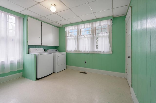704 Lincoln St, Coffeyville, KS 67337 - washroom with washer and dryer, healthy amount of natural light, and cabinet space