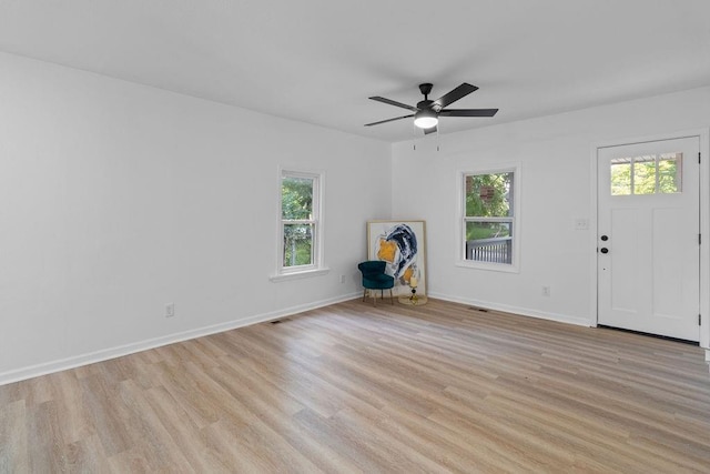 1233 S Pleasant St, Independence, MO 64055 - foyer entrance with light wood finished floors and a ceiling fan