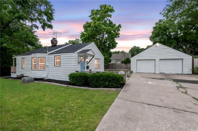 9521 W 60th St, Merriam, KS 66203 - view of front of home featuring an outbuilding, a detached garage, and a chimney