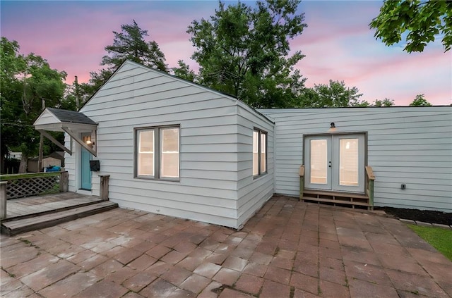 9521 W 60th St, Merriam, KS 66203 - back of property with french doors and a patio area