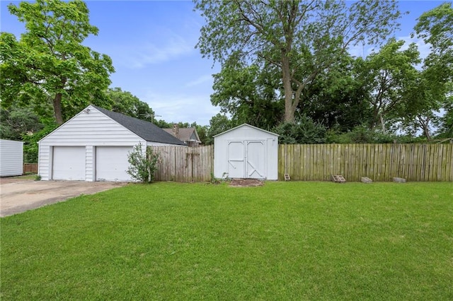 9521 W 60th St, Merriam, KS 66203 - view of yard with a detached garage and a storage shed