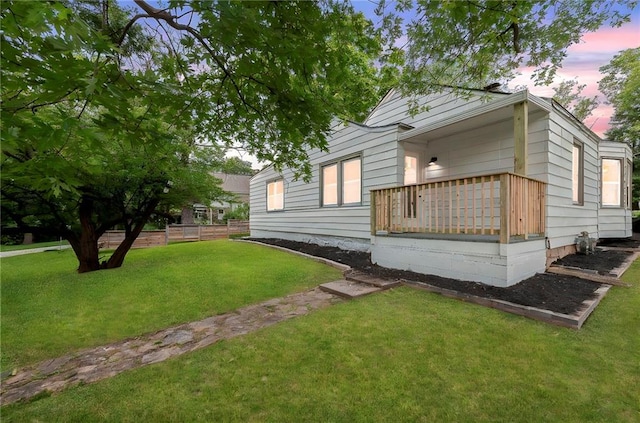 9521 W 60th St, Merriam, KS 66203 - property exterior at dusk with a lawn