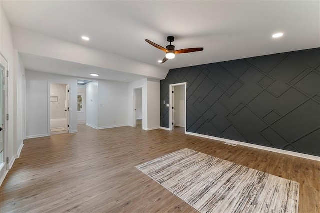 9521 W 60th St, Merriam, KS 66203 - unfurnished room featuring a ceiling fan, wood finished floors, recessed lighting, and an accent wall
