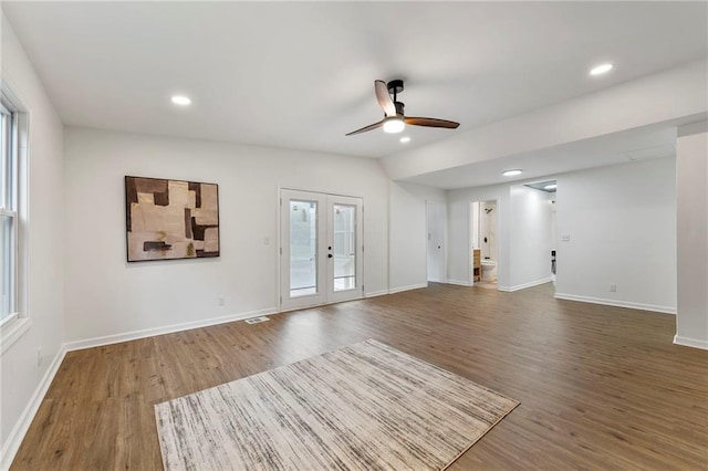 9521 W 60th St, Merriam, KS 66203 - unfurnished living room featuring wood finished floors, a ceiling fan, plenty of natural light, and recessed lighting