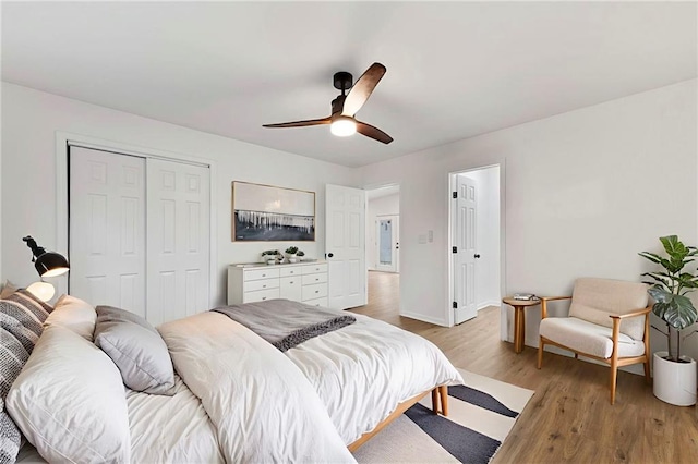 9521 W 60th St, Merriam, KS 66203 - bedroom with light wood finished floors, a closet, and a ceiling fan