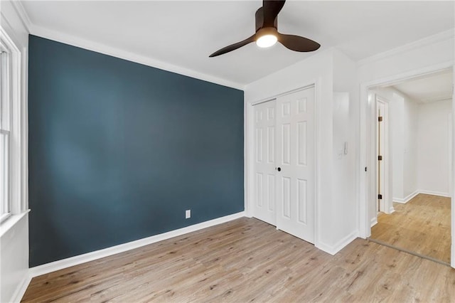9521 W 60th St, Merriam, KS 66203 - unfurnished bedroom with wood finished floors, a closet, a ceiling fan, and crown molding