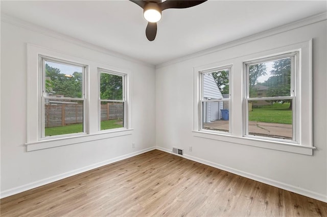 9521 W 60th St, Merriam, KS 66203 - unfurnished room featuring plenty of natural light, light wood-type flooring, ornamental molding, and ceiling fan