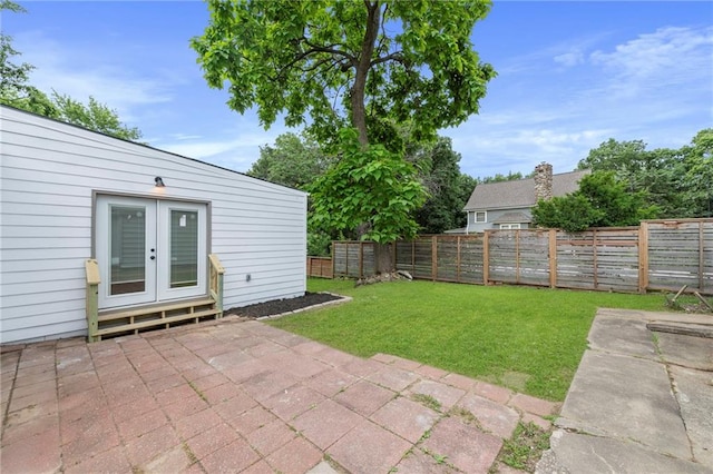 9521 W 60th St, Merriam, KS 66203 - fenced backyard with french doors and a patio area