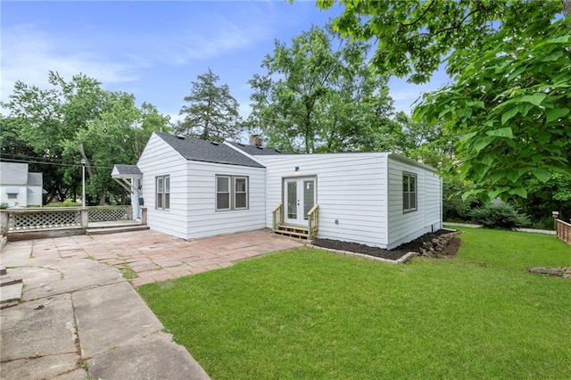 9521 W 60th St, Merriam, KS 66203 - rear view of property with french doors, a patio, and a chimney