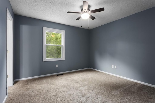33145 W 88th Ter, De Soto, KS 66018 - carpeted spare room with a textured ceiling and a ceiling fan