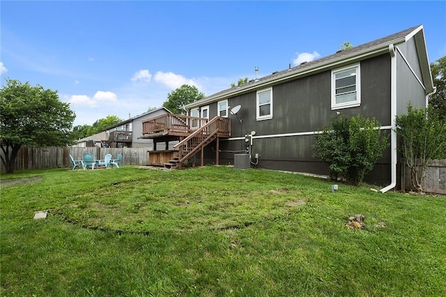 33145 W 88th Ter, De Soto, KS 66018 - rear view of house with a fenced backyard, a wooden deck, and stairway