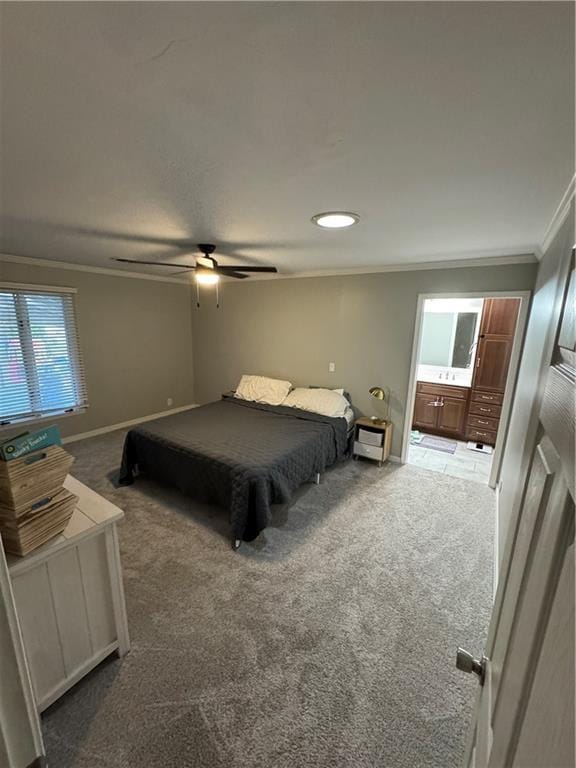 906 S Denman, Chanute, KS 66720 - carpeted bedroom with ornamental molding, ensuite bathroom, and a ceiling fan