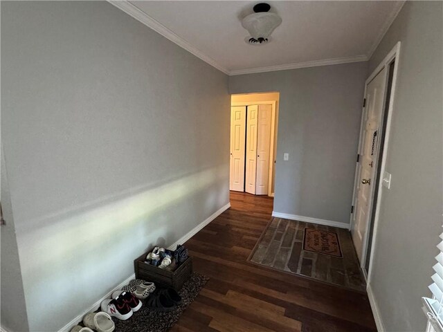 906 S Denman, Chanute, KS 66720 - corridor featuring wood finished floors and ornamental molding