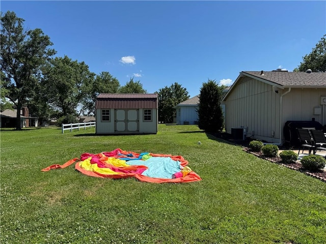 906 S Denman, Chanute, KS 66720 - view of grassy yard with a storage unit