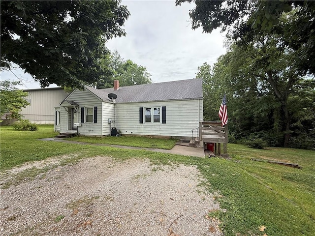 529 S Business Highway 13, Lexington, MO 64067 - view of front of property featuring a front yard, roof with shingles, and a chimney