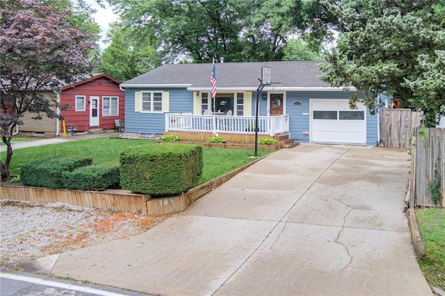 702 Green St, Lees Summit, MO 64063 - ranch-style house with covered porch, a garage, and concrete driveway