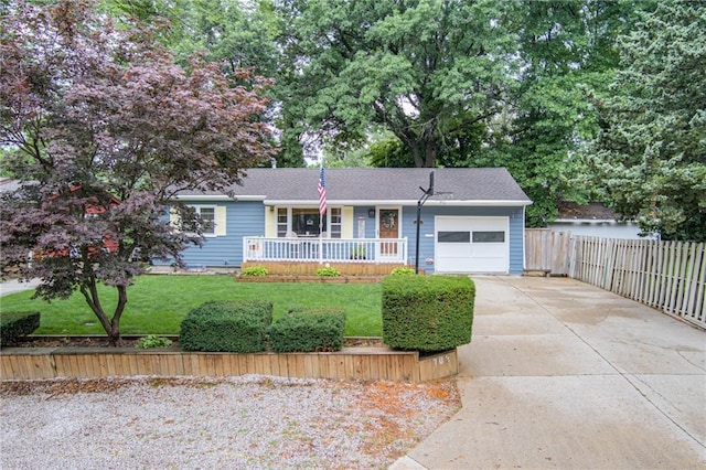 702 Green St, Lees Summit, MO 64063 - ranch-style house featuring an attached garage, driveway, and covered porch