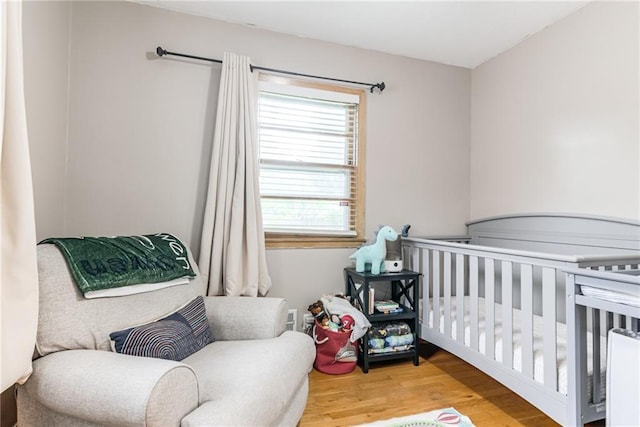 702 Green St, Lees Summit, MO 64063 - bedroom featuring wood finished floors