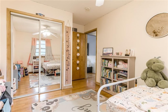 702 Green St, Lees Summit, MO 64063 - bedroom featuring wood finished floors, a closet, and ceiling fan