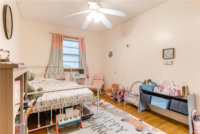 702 Green St, Lees Summit, MO 64063 - bedroom with wood finished floors and a ceiling fan