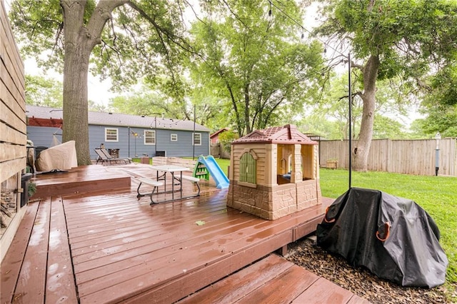 702 Green St, Lees Summit, MO 64063 - wooden deck with a fenced backyard and area for grilling