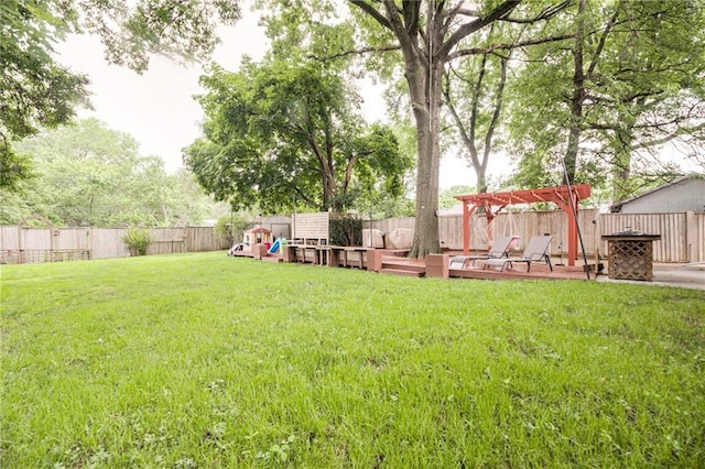 702 Green St, Lees Summit, MO 64063 - fenced backyard with a playground, a pergola, and a deck