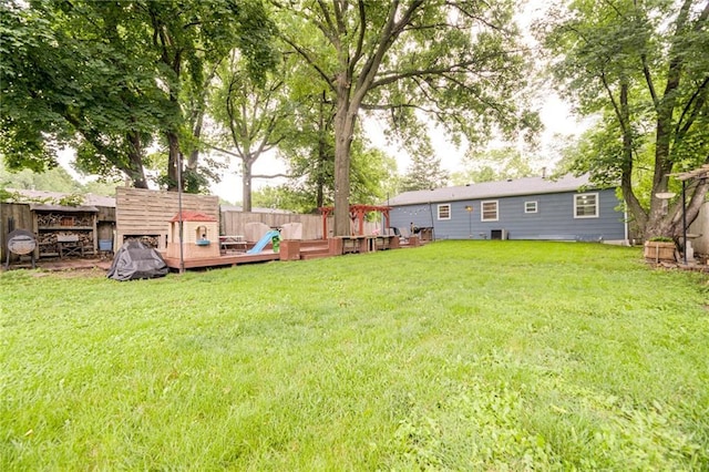 702 Green St, Lees Summit, MO 64063 - fenced backyard with a deck