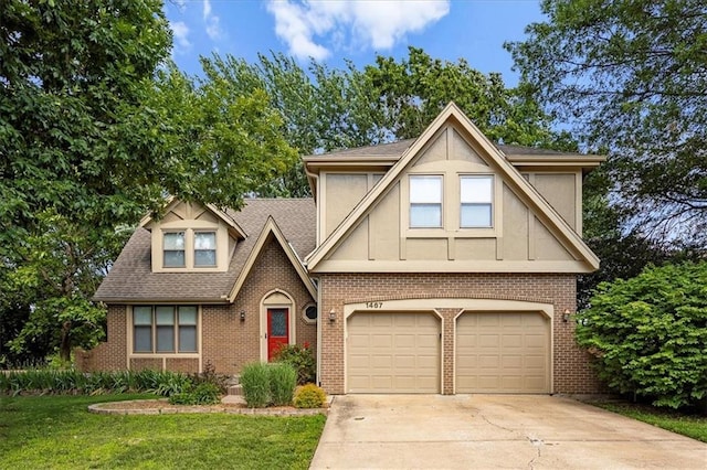 1467 E Orleans Dr, Olathe, KS 66062 - tudor home featuring a garage, driveway, brick siding, a front yard, and roof with shingles