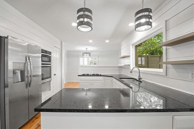 1467 E Orleans Dr, Olathe, KS 66062 - kitchen with appliances with stainless steel finishes, open shelves, a peninsula, white cabinets, and recessed lighting