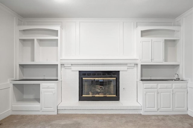 1467 E Orleans Dr, Olathe, KS 66062 - unfurnished living room featuring carpet floors and a brick fireplace
