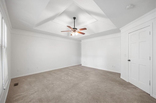 1467 E Orleans Dr, Olathe, KS 66062 - unfurnished bedroom with carpet flooring, a tray ceiling, crown molding, and a ceiling fan
