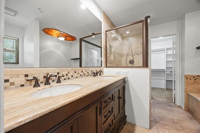 1467 E Orleans Dr, Olathe, KS 66062 - bathroom with a stall shower, double vanity, a spacious closet, tasteful backsplash, and recessed lighting