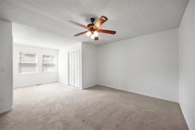 1467 E Orleans Dr, Olathe, KS 66062 - carpeted empty room featuring ceiling fan and a textured ceiling